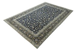 Corner detail of 2000s Kashan rug showing border pattern and Wool pile