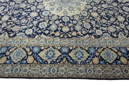Corner detail of 2000s Kashan rug showing border pattern and Wool pile