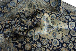Surface texture of 2000s Kashan rug with natural Wool and intricate pattern