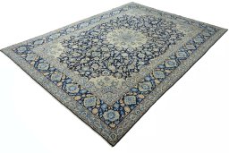 Corner detail of 2000s Kashan rug showing border pattern and Wool pile