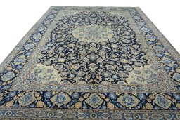 Surface texture of 2000s Kashan rug with natural Wool and intricate pattern