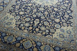 Close-up detail of 2000s Kashan rug from Iran / Persia showing Wool weave