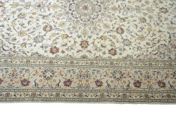 Corner detail of 2000s Kashan rug showing border pattern and Wool pile