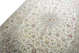 Backside of handmade 2000s Kashan rug showing knot structure and weave density