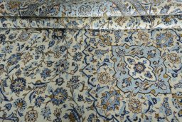 Close-up detail of 2000s Kashan rug from Iran / Persia showing Wool weave