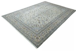 Corner detail of 2000s Kashan rug showing border pattern and Wool pile