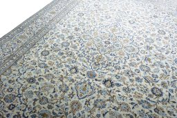 Backside of handmade 2000s Kashan rug showing knot structure and weave density