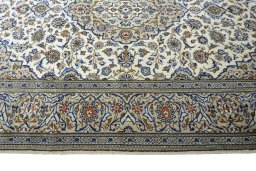 Corner detail of 2000s Kashan rug showing border pattern and Wool pile