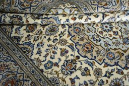 Close-up detail of 2000s Kashan rug from Iran / Persia showing Wool weave