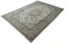 Corner detail of 2000s Kashan rug showing border pattern and Wool pile