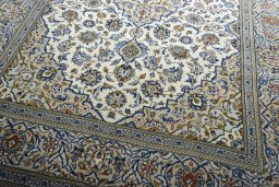 Close-up detail of 2000s Kashan rug from Iran / Persia showing Wool weave