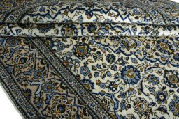 Close-up detail of 2000s Kashan rug from Iran / Persia showing Wool weave