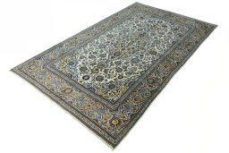 Corner detail of 2000s Kashan rug showing border pattern and Wool pile
