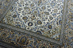 Close-up detail of 2000s Kashan rug from Iran / Persia showing Wool weave