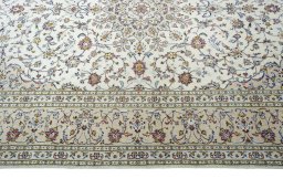 Corner detail of New Kashan rug showing border pattern and Wool pile