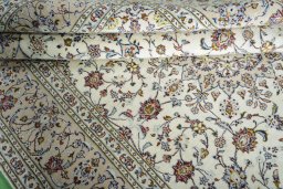 Close-up detail of New Kashan rug from Iran / Persia showing Wool weave
