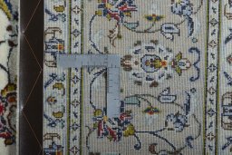 Backside of handmade New Kashan rug showing knot structure and weave density