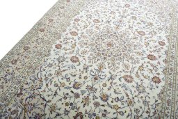 Backside of handmade New Kashan rug showing knot structure and weave density
