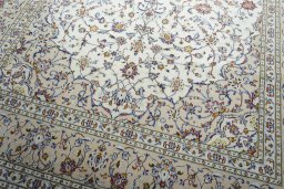 Close-up detail of New Kashan rug from Iran / Persia showing Wool weave