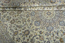 Close-up detail of 2000s Kashan rug from Iran / Persia showing Wool weave