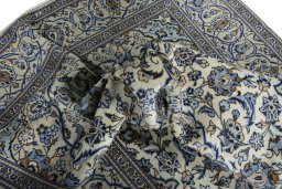 Surface texture of 2000s Kashan rug with natural Wool and intricate pattern