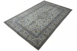 Corner detail of 2000s Kashan rug showing border pattern and Wool pile
