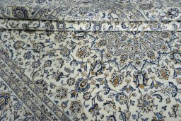 Close-up detail of 2000s Kashan rug from Iran / Persia showing Wool weave