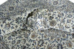 Surface texture of 2000s Kashan rug with natural Wool and intricate pattern