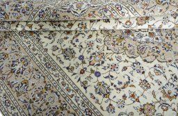 Close-up detail of 2000s Kashan rug from Iran / Persia showing Wool weave