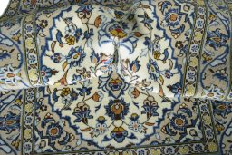 Surface texture of 2000s Kashan rug with natural Wool and intricate pattern