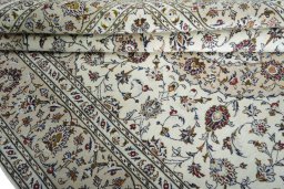 Close-up detail of 2000s Kashan rug from Iran / Persia showing Wool weave