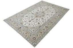 Corner detail of 2000s Kashan rug showing border pattern and Wool pile