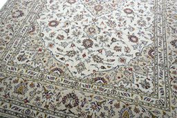 Close-up detail of 2000s Kashan rug from Iran / Persia showing Wool weave