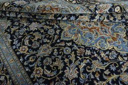 Close-up detail of 2000s Kashan rug from Iran / Persia showing Wool weave