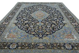 Surface texture of 2000s Kashan rug with natural Wool and intricate pattern