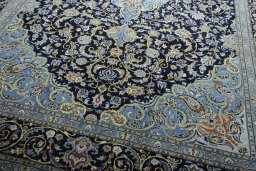 Close-up detail of 2000s Kashan rug from Iran / Persia showing Wool weave