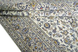 Close-up detail of 2000s Kashan rug from Iran / Persia showing Wool weave