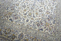 Close-up detail of 2000s Kashan rug from Iran / Persia showing Wool weave