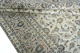 Close-up detail of 2000s Kashan rug from Iran / Persia showing Wool weave