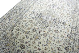 Backside of handmade 2000s Kashan rug showing knot structure and weave density