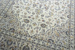 Close-up detail of 2000s Kashan rug from Iran / Persia showing Wool weave