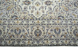 Full view of 2000s Kashan rug from Iran / Persia, 301 × 208 cm in Beige tones
