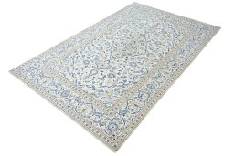 Corner detail of 2000s Kashan rug showing border pattern and Wool pile