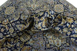 Surface texture of 2000s Kashan rug with natural Wool and intricate pattern