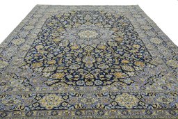 Surface texture of 2000s Kashan rug with natural Wool and intricate pattern