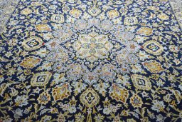 Central medallion detail of 2000s Kashan rug from Iran / Persia