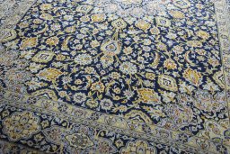 Close-up detail of 2000s Kashan rug from Iran / Persia showing Wool weave