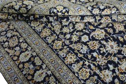 Close-up detail of 2000s Kashan rug from Iran / Persia showing Wool weave