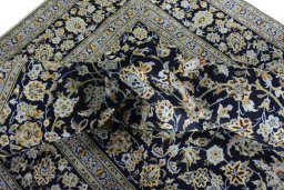 Surface texture of 2000s Kashan rug with natural Wool and intricate pattern