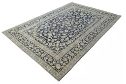Corner detail of 2000s Kashan rug showing border pattern and Wool pile